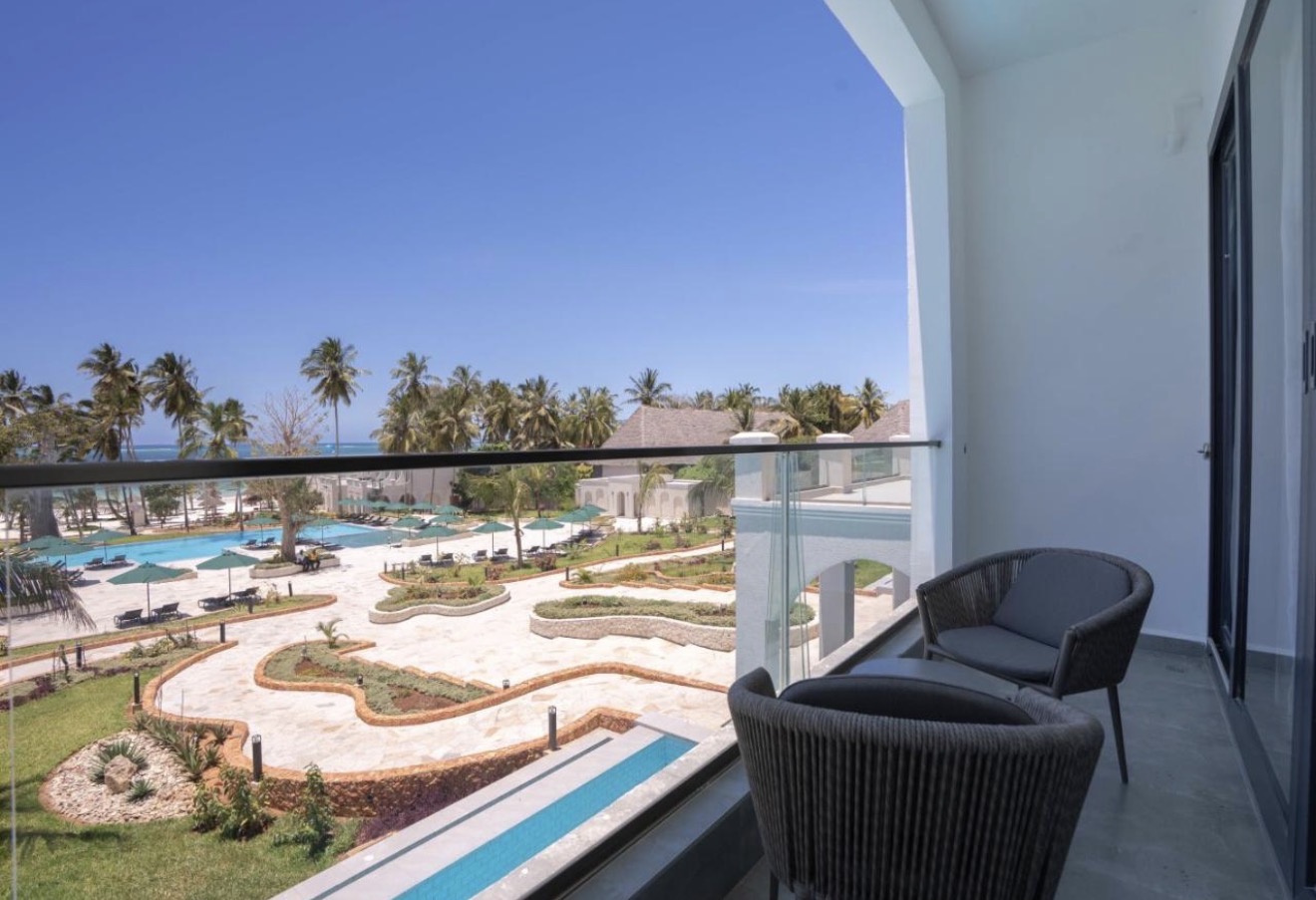 Private balcony overlooking the resort pools and palms