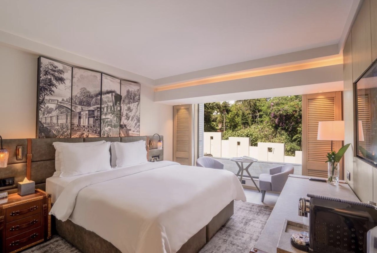 Guest room with king bed and garden view